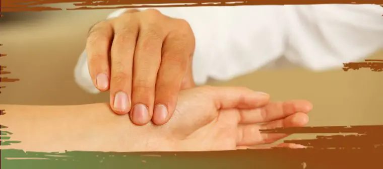 This image depicts someone's pulse being taken to illustrate issues in healthcare in rural Canada.