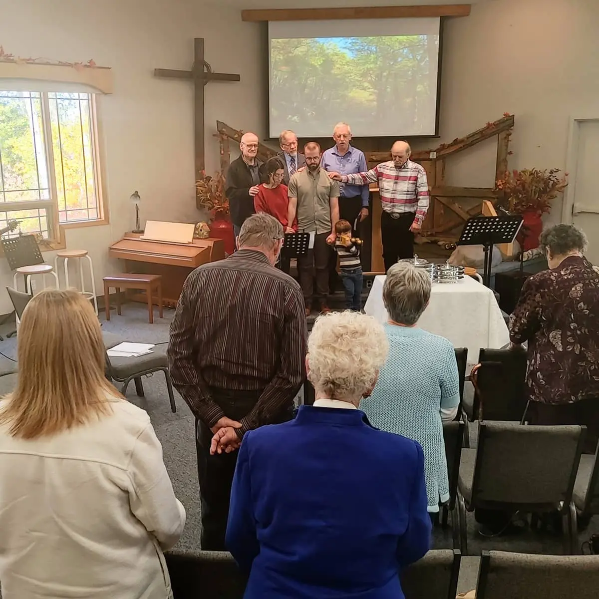 2024 Joel Brooks Internship Prayer Rural church leaders pray for a family.