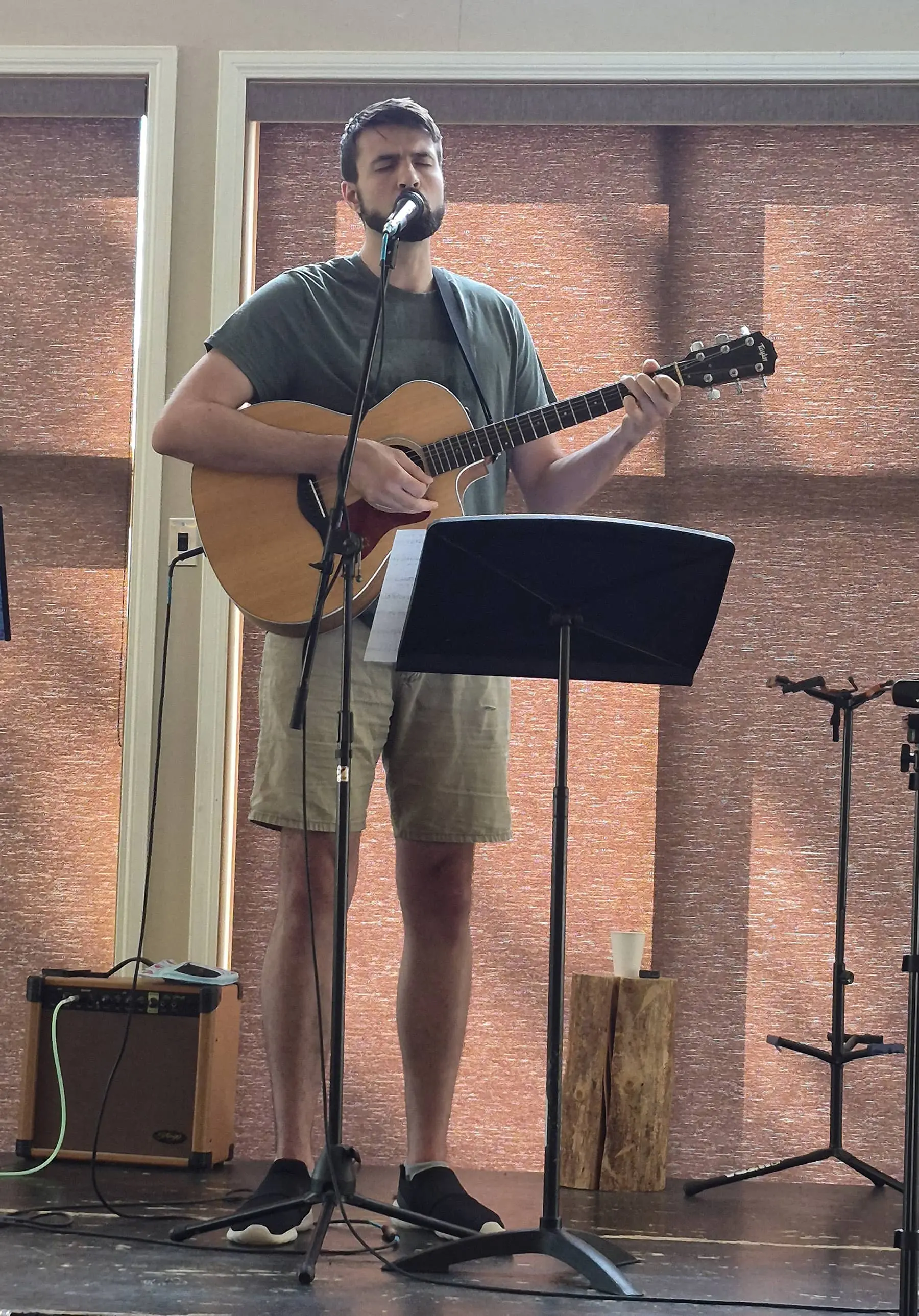 Jay Foster plays his guitar and sings.